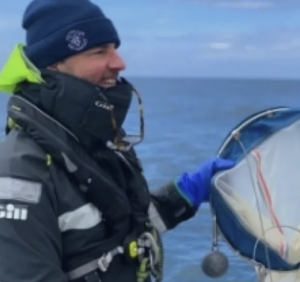 Yacht owner reviewing donation paperwork with Paul Madden